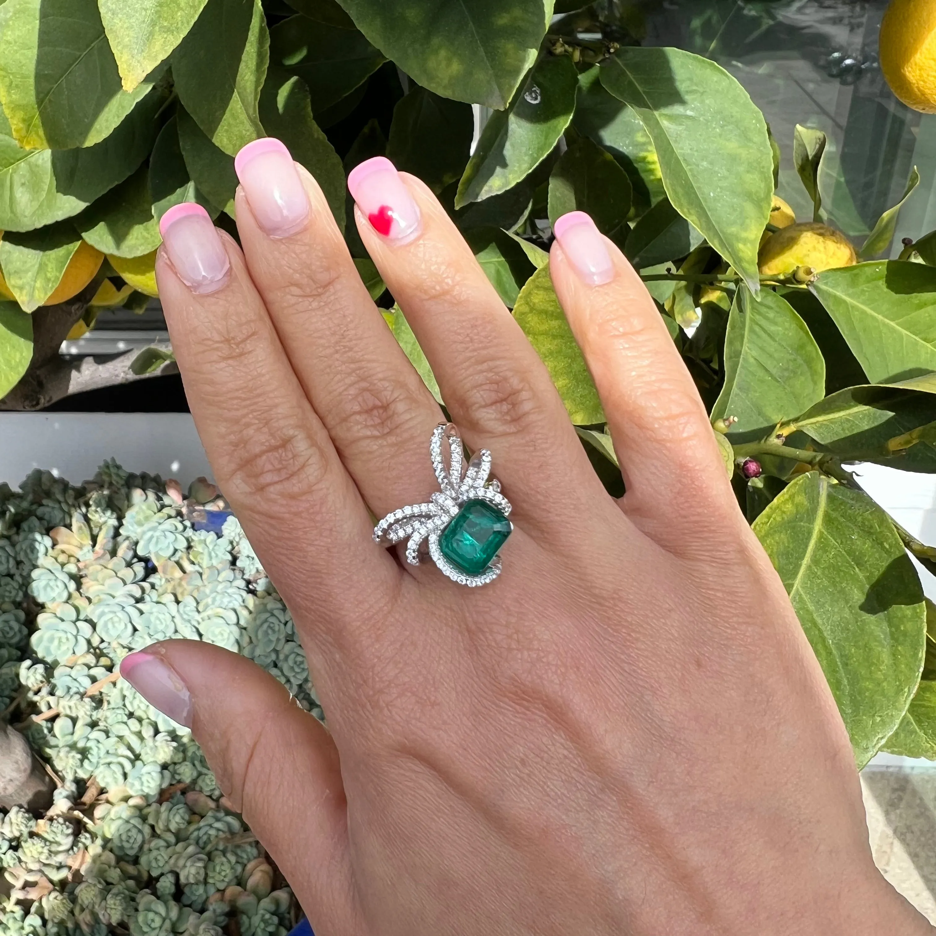 Sterling silver emerald bow ring